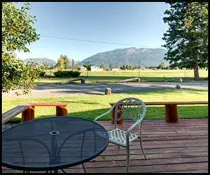 Enjoy the Birdwatchers deck with patio furniture and view of Chief Joseph Mountain