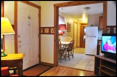 The Red Rooster Suite’s kitchen is outfitted with full-sized refrigerator, range, microwave and cookware.