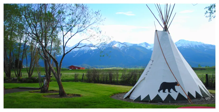 Tepees in spring at Mountain View RV Park with snow-capped Wallowa Mtns backdrop  