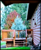 Sunflower Suite private deck with patio furniture and BBQ grille at the Mountain View Motel.