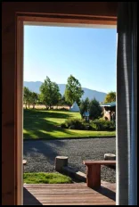 The wildflower garden, tepees and Wallow Mountains from the back deck of the Mountain Lakes Room near Joseph, Oregon.